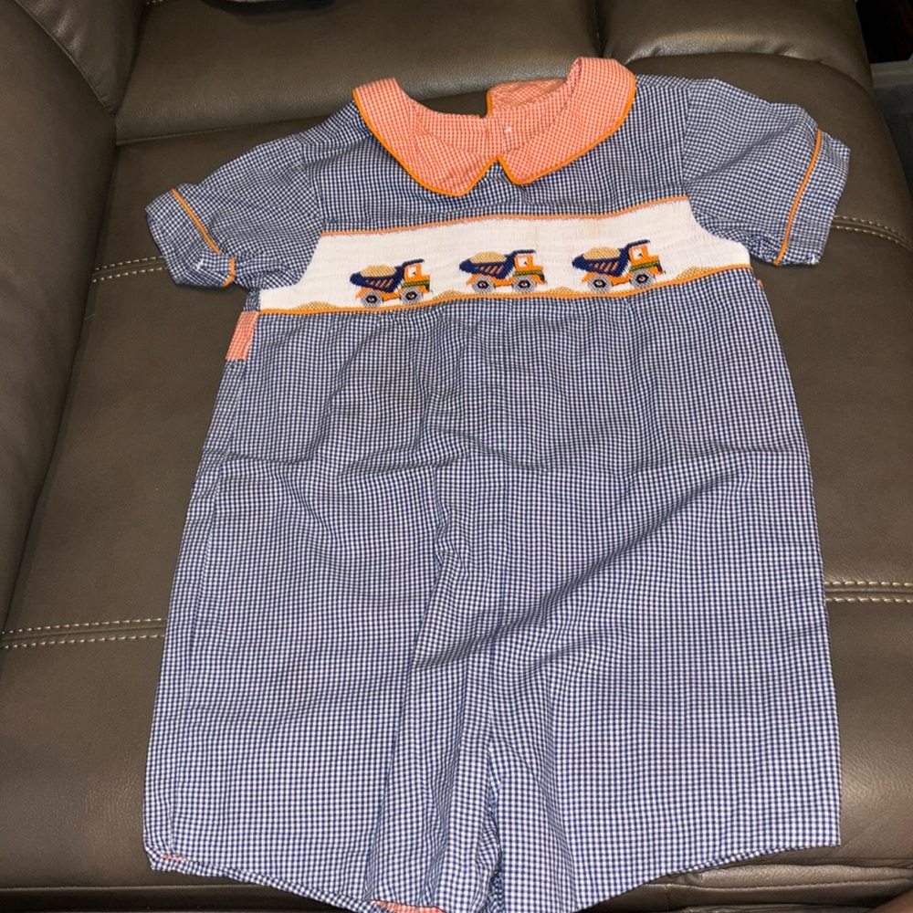 Beaux et Belles navy gingham check one piece with dump trucks on the front smock